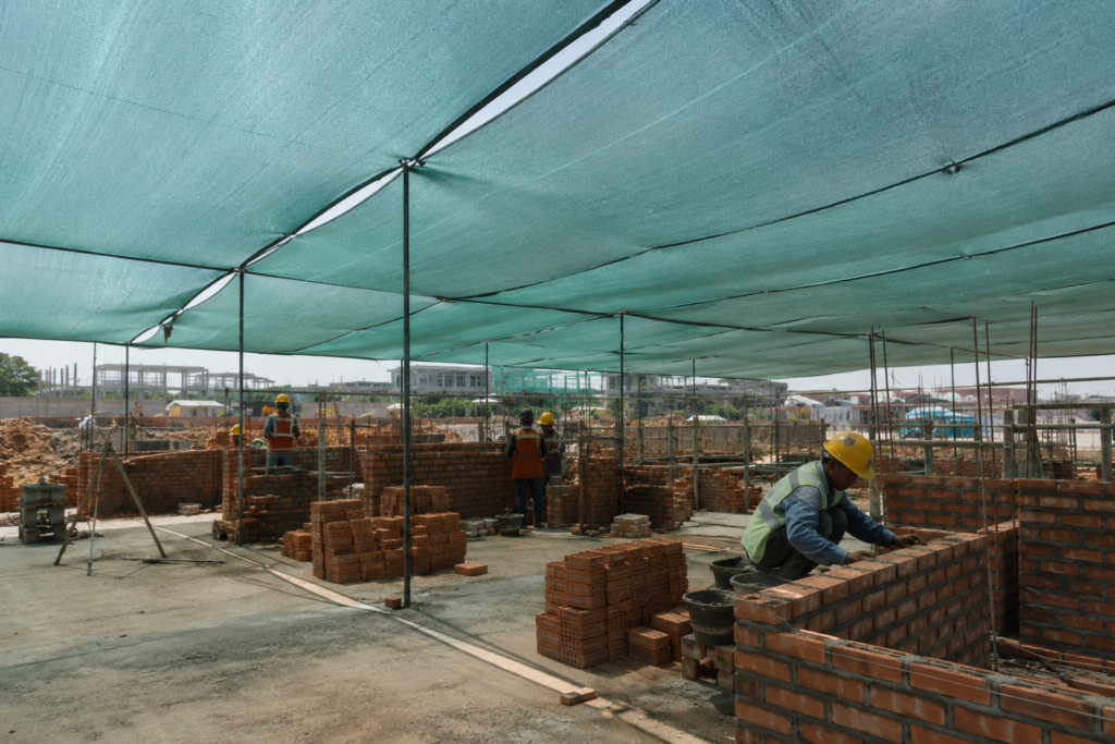 construction site with shade nets over the work area